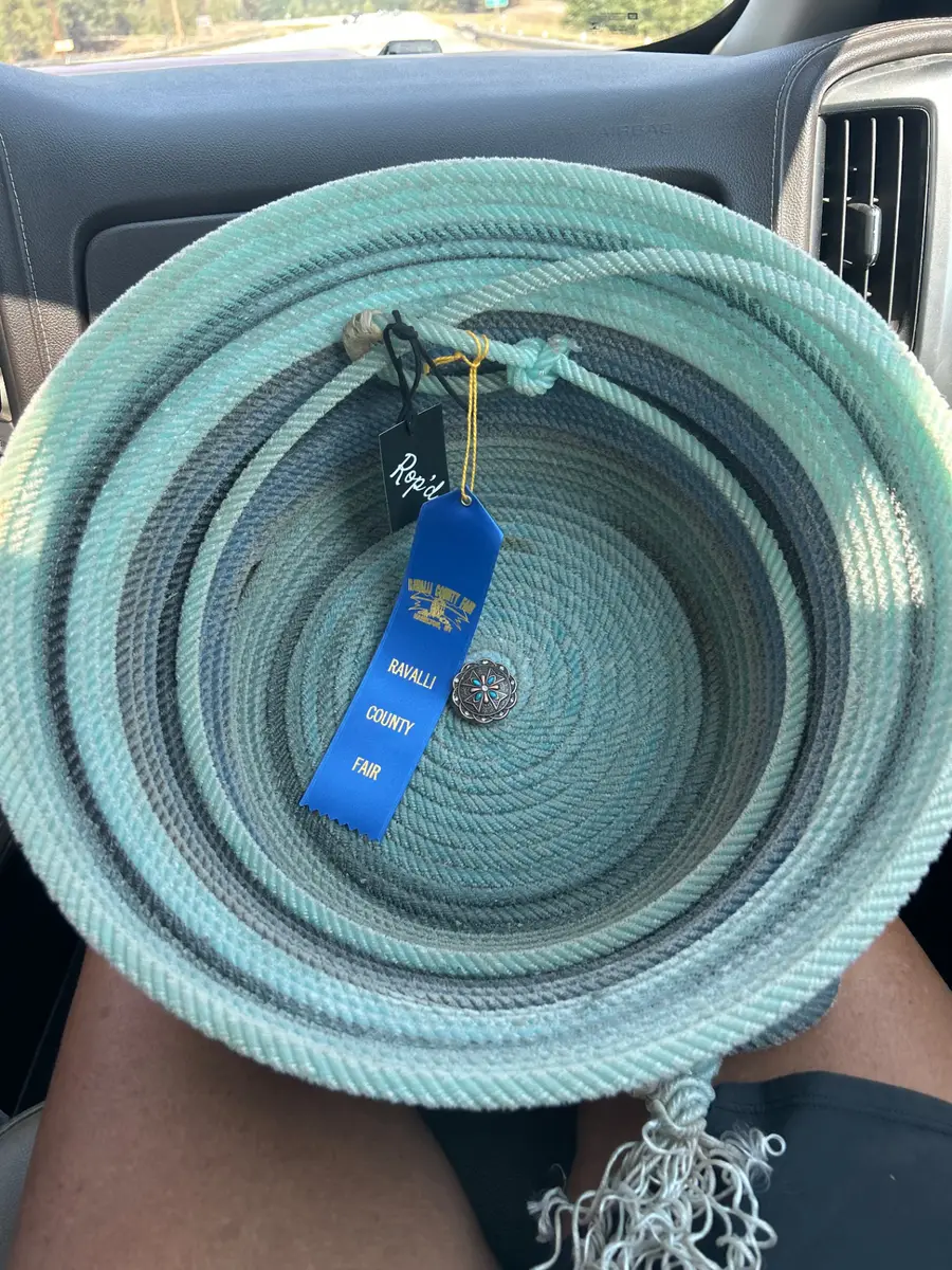 Teal and gray rope basket with a Ravalli County Fair blue ribbon and Rop'd tag